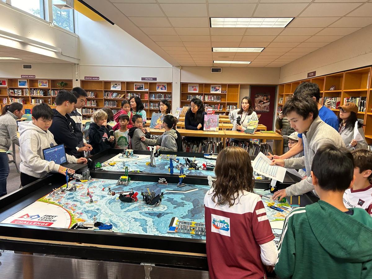 FLL teams practicing a robot game at Mercury's mock qualifier